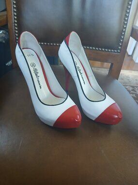 New and unworn red and white leather pumps.